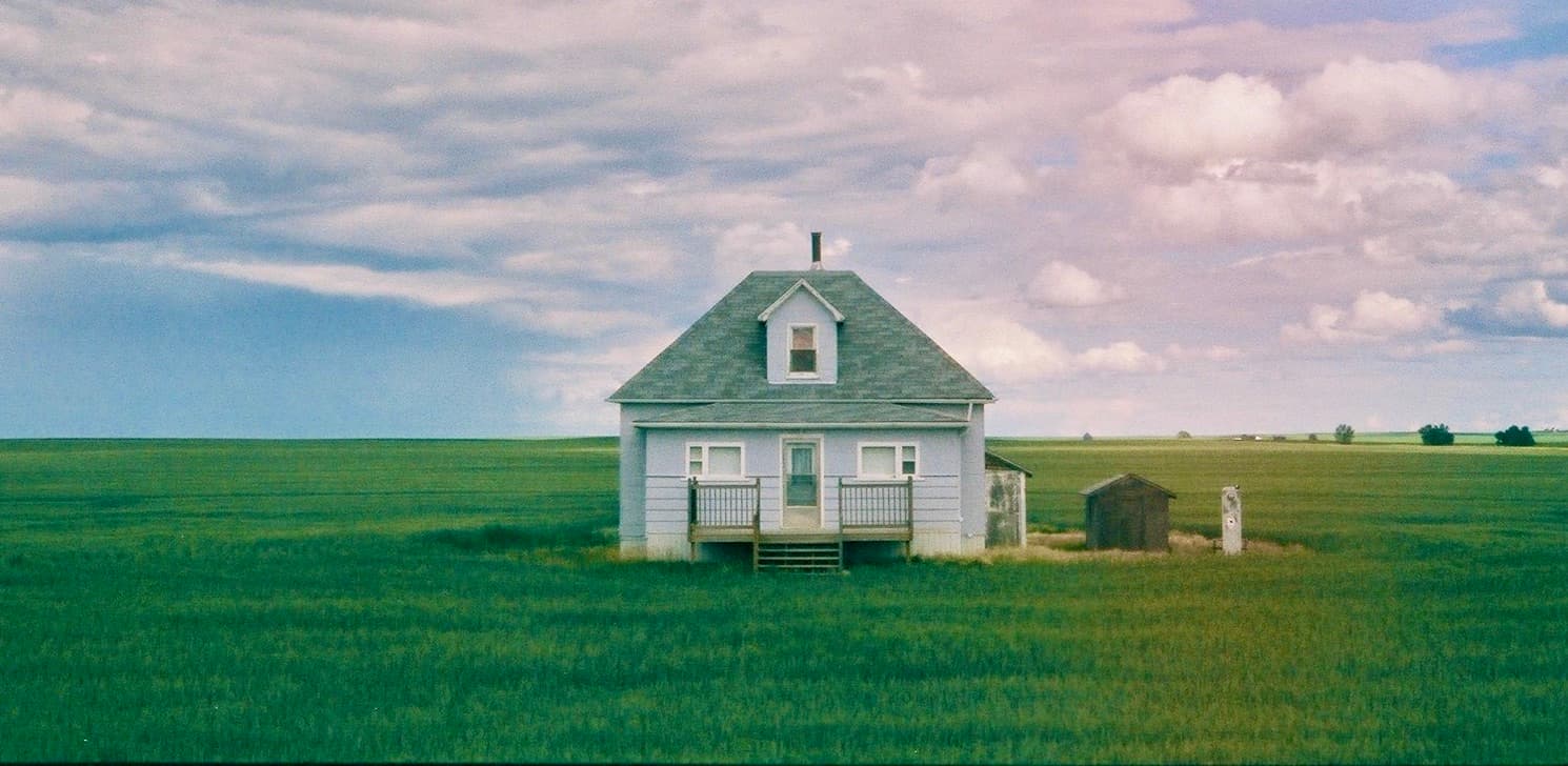 house in a green field